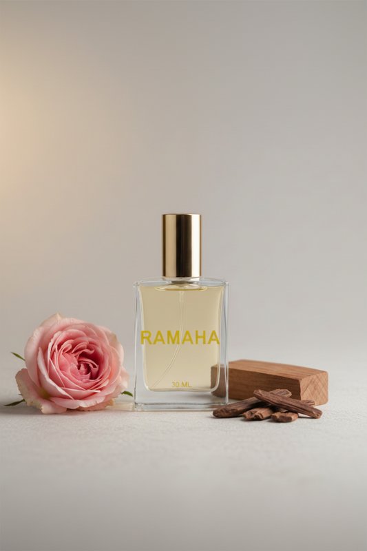 Perfume bottle labeled 'Ramaha' with a pink rose and cinnamon sticks on a light background