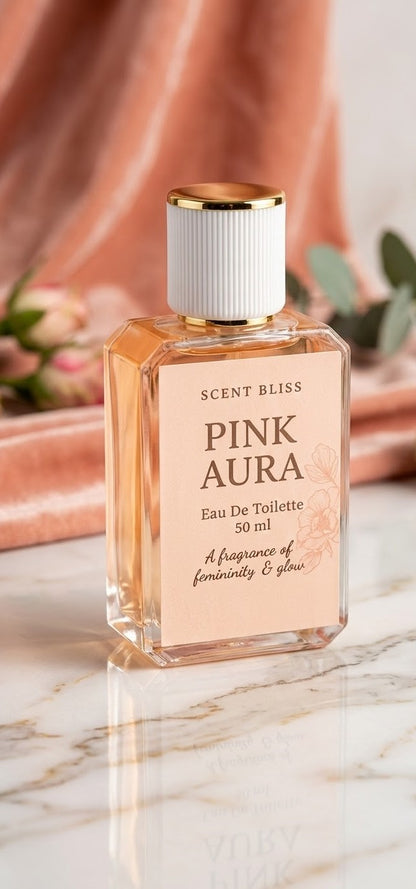 Scent Bliss Pink Aura perfume bottle on a marble surface with a soft pink background